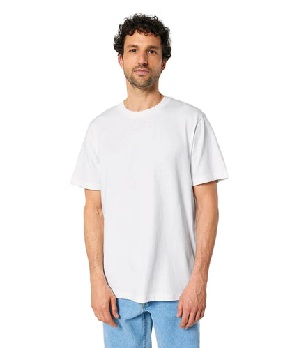Man wearing a plain white t-shirt and light blue jeans against a gray background